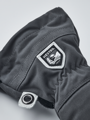 Hestra junior ski glove in dark gray/black with Hestra patch and wrist strap