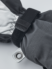 Gray junior ski gloves with black wrist strap and leather palm with eyelet