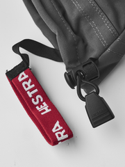 Junior ski glove wrist strap with red HESTRA lettering and black adjuster
