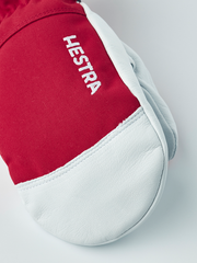 Kids ski mittens with red back, white leather palm, and white HESTRA lettering