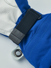 Hestra junior ski gloves in royal blue with black hook-and-loop wrist strap and ring detail