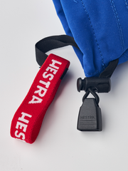 Junior ski mittens in royal blue with red “HESTRA” lanyard and black lock
