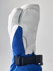 Hestra junior mitten in white with blue inner panel and black wrist strap