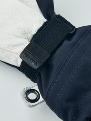 Junior ski gloves in navy blue with black wrist strap and metal grommet