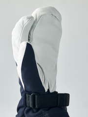 Hestra junior mitten in white with navy interior and black adjustable wrist strap