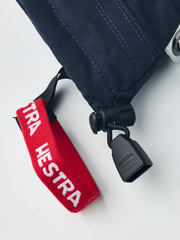 Junior ski glove cuff in navy with red “HESTRA” strap and black attachment lock