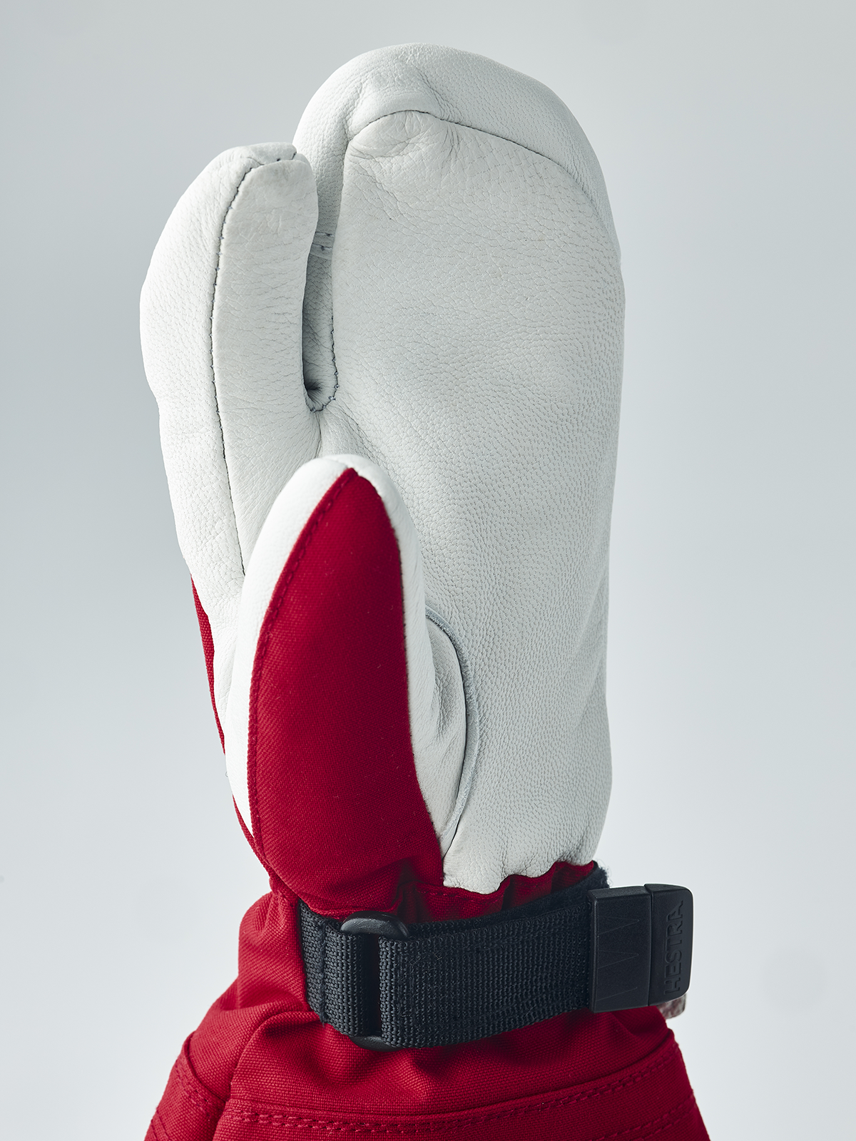 Junior ski gloves and mittens with white leather, red interior, black wrist strap