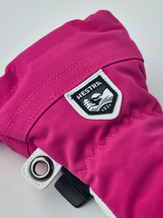 Junior ski mitten in fuchsia with white Hestra patch and black snap wrist strap