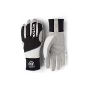 Colorblocked winter gloves in black, off-white, and dark navy with Hestra patch logo