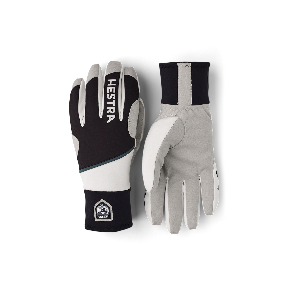 Colorblocked winter gloves in black, off-white, and dark navy with Hestra patch logo