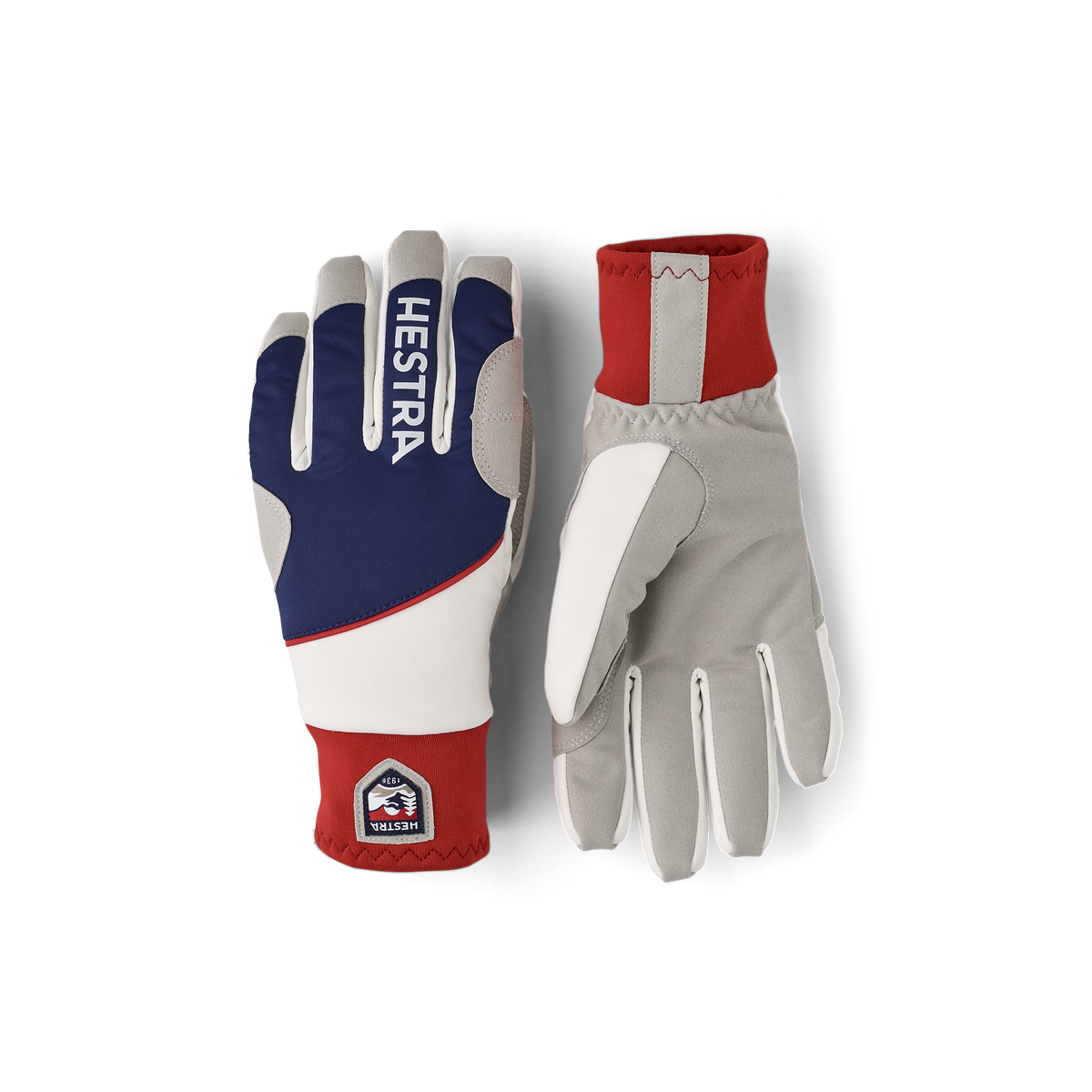 Colorblocked winter gloves in navy, off-white, and red with Hestra patch logo