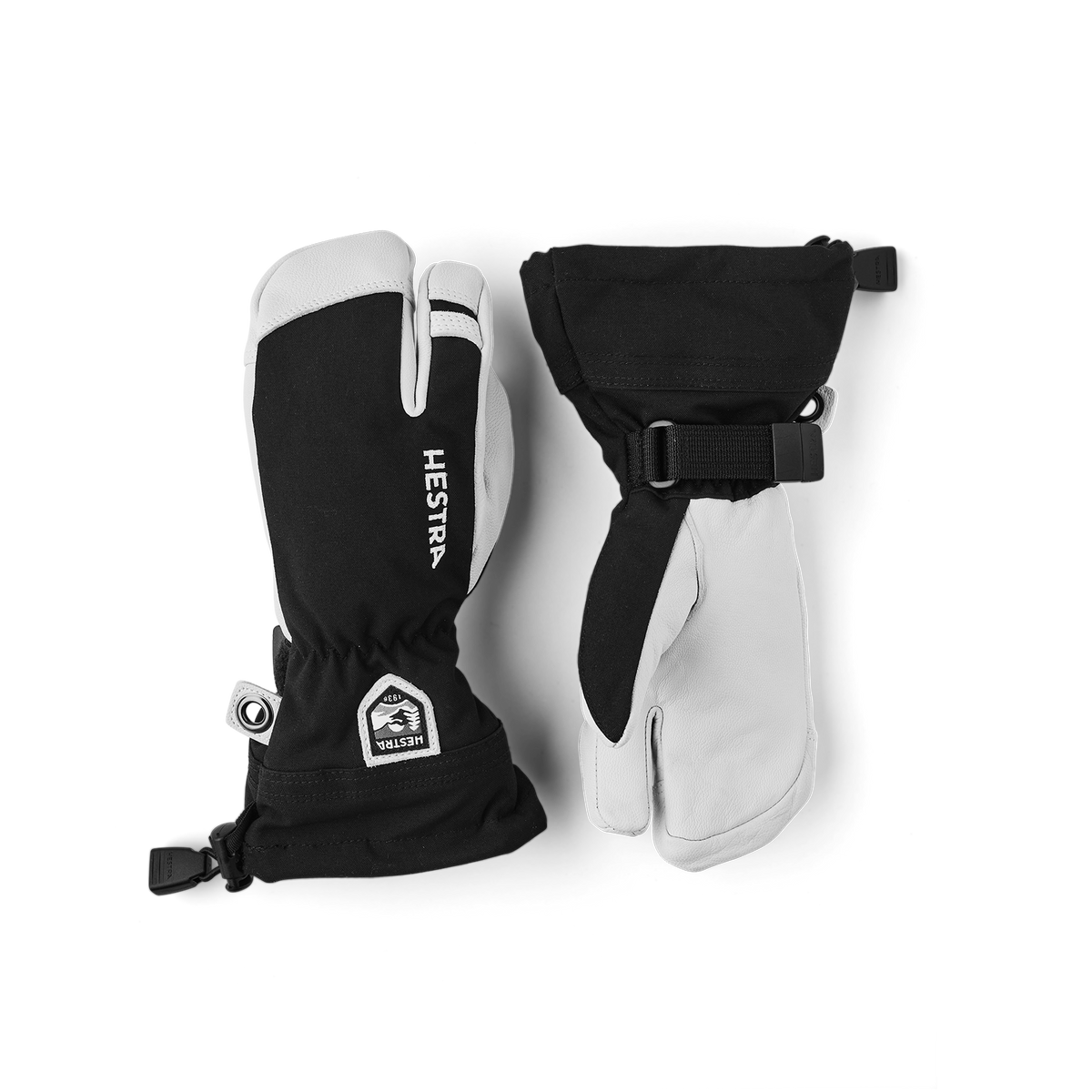 Pair of Hestra junior ski gloves in black with white palms and wrist strap closures