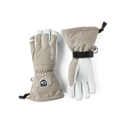 Light taupe ski gloves with leather palm, side cuff strap and Hestra patch.