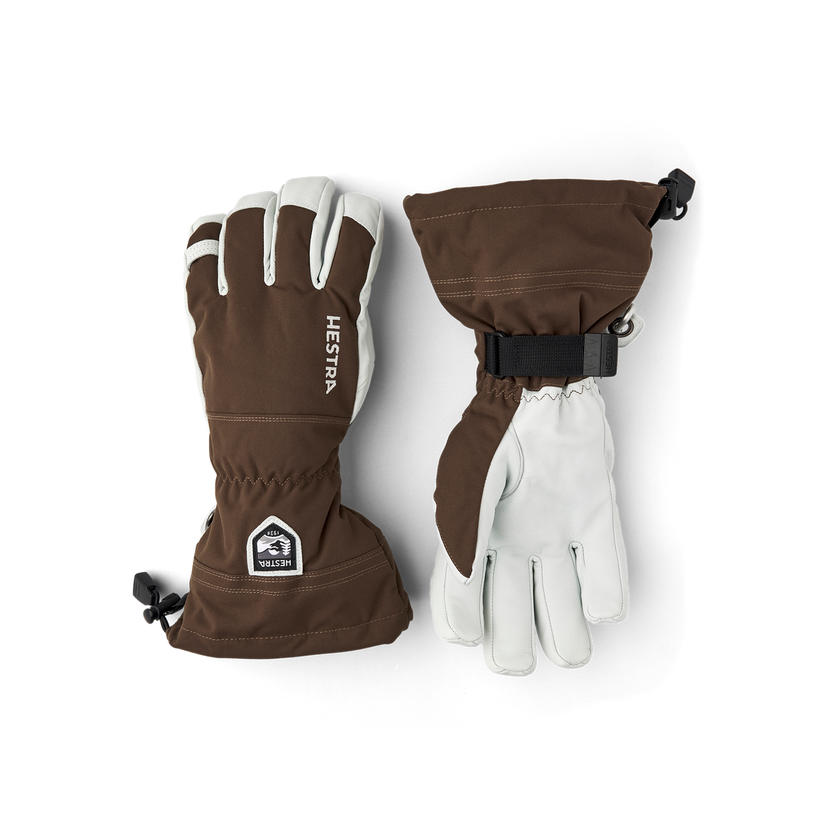 Brown ski gloves with Hestra logo patch and light leather accents