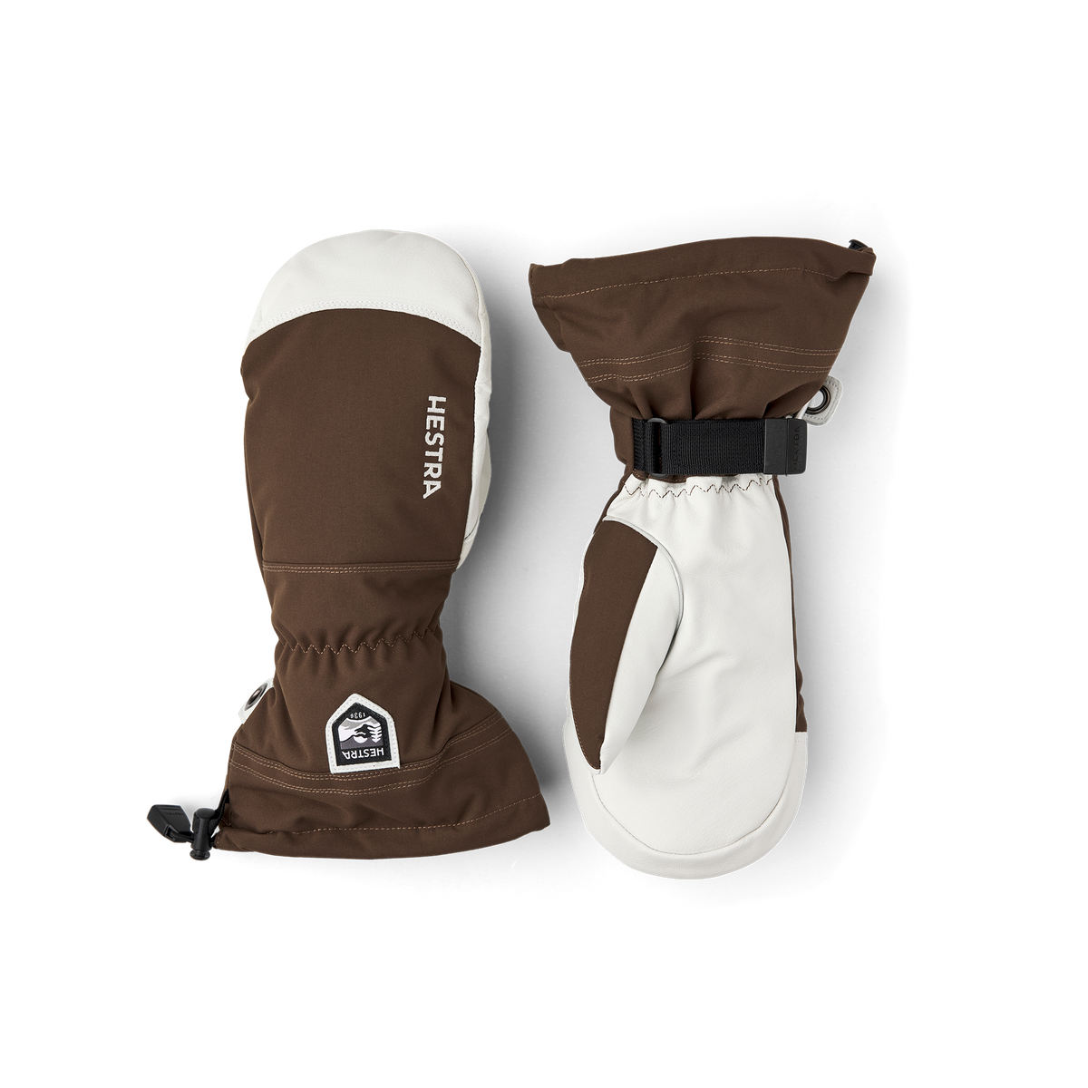 Brown and white pair of ski mittens with wrist strap and Hestra patch