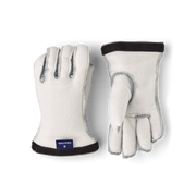 Hestra kids' ski glove liners in off-white fleece with dark cuff and light-blue stitching