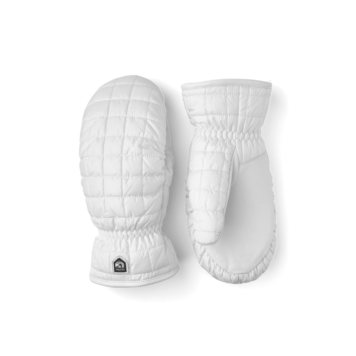 White padded mittens with quilted pattern and elastic cuff, Hestra-style design patch