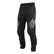 Youth sprint pants, black with white logo patches and zippered knee panel details.