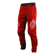 Youth red sprint pants with black knee panels and logo
