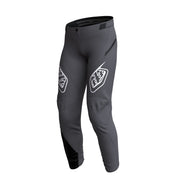 Youth sprint pants in charcoal gray with stitched paneling and printed logos