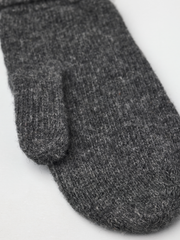 Dark grey knit mitten liner with ribbed cuff, close-up.