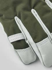 Olive green ski gloves with light gray leather palms and stitched finger panels