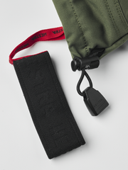 Olive and black Hestra ski mittens with adjustable wrist strap and cord lock