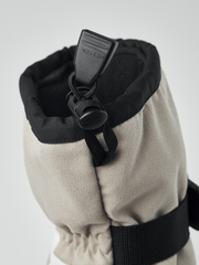 Black and beige powder gauntlet mitten with hanging toggle and elastic wrist cuff