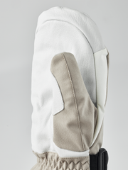 White powder gauntlet mitten with beige thumb insert and black wrist strap