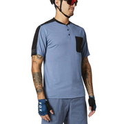 Blue short-sleeve henley shirt with button placket and dark side pocket panel