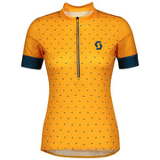 Women's cycling jersey in amber yellow with black dot print, dark blue sleeves, zip front
