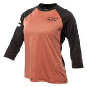 Women’s Sidewinder raglan jersey in mauve with black sleeves and orange-stitched seams.