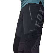 Fox Flexair Pro pant close-up: black abrasion panel with zipper and Dyneema logo