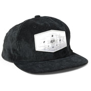 Black baseball cap with front patch label and stitched eyelets