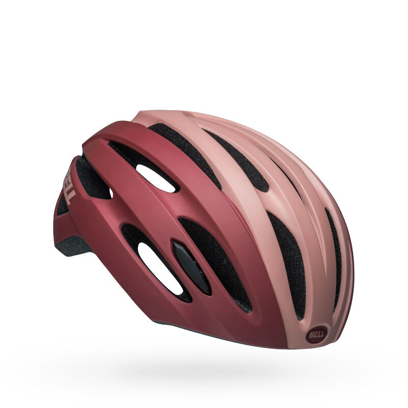 Pink and black vented bike helmet with oval openings and low-profile LED housing
