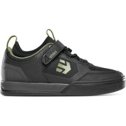 Etnies black low-top bike shoe with Velcro strap and green logo detail