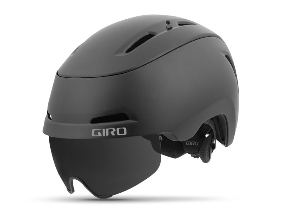 Matte black bike helmet with attached visor and chin strap, side logo