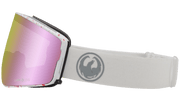 Dragon Alliance PXV2 snow goggles with pink mirrored lens and white fabric strap