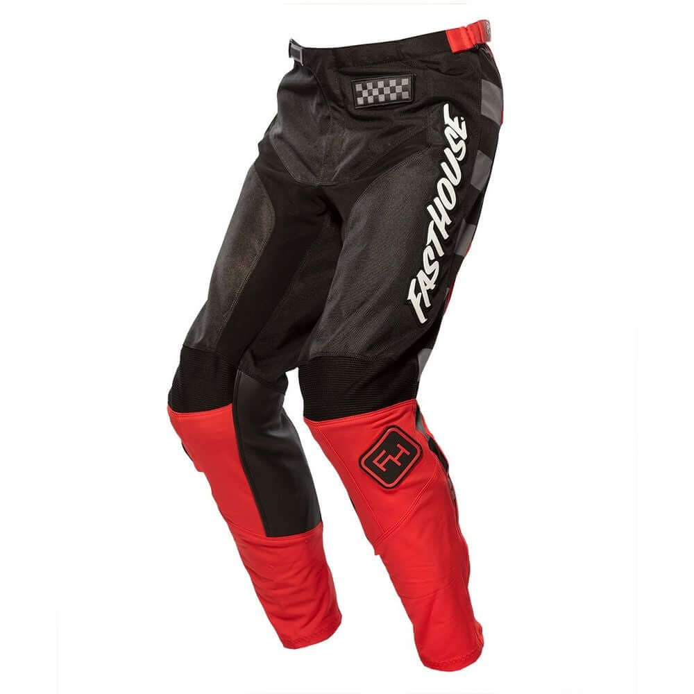 Youth motocross pants in black with red panels and logo patch at waist