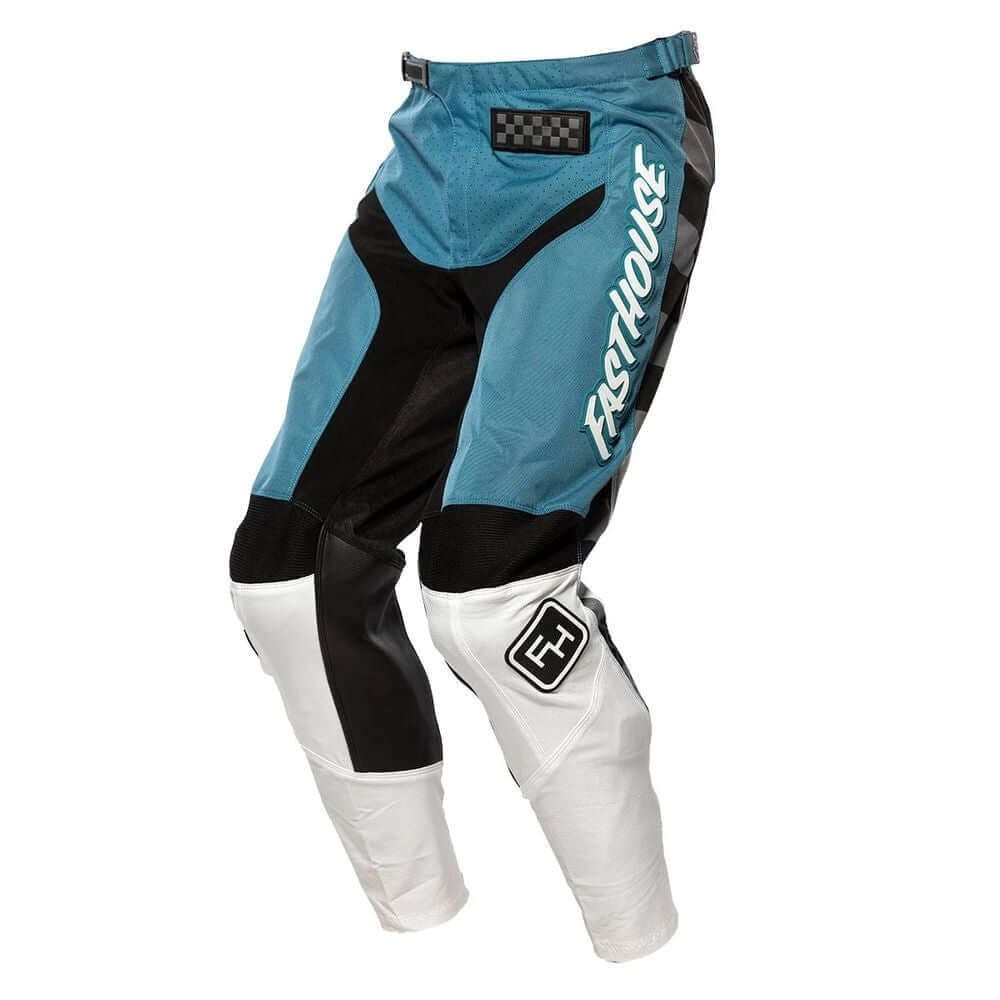 Youth motocross pants in teal and black with white knee panels and logo patch