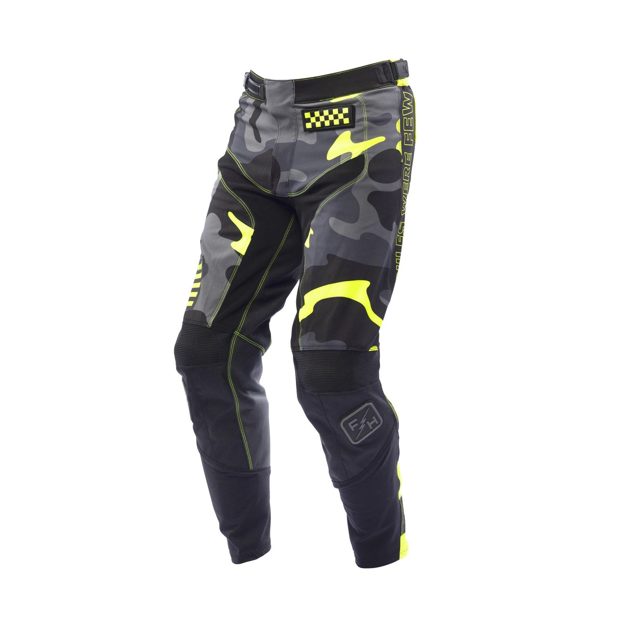 Youth riot pants in black with neon yellow accents and camo panels