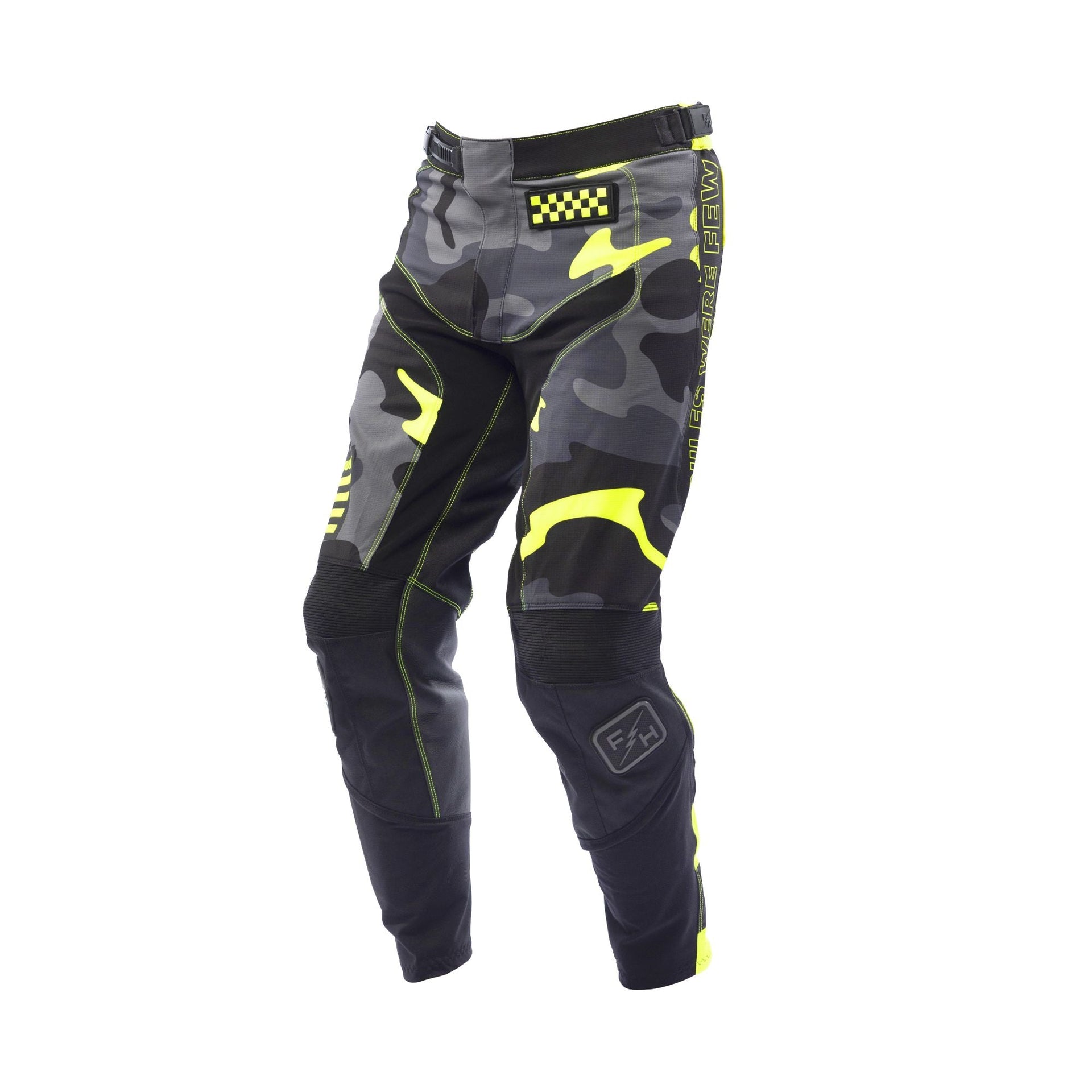Youth riot pants in black with neon yellow accents and camo panels