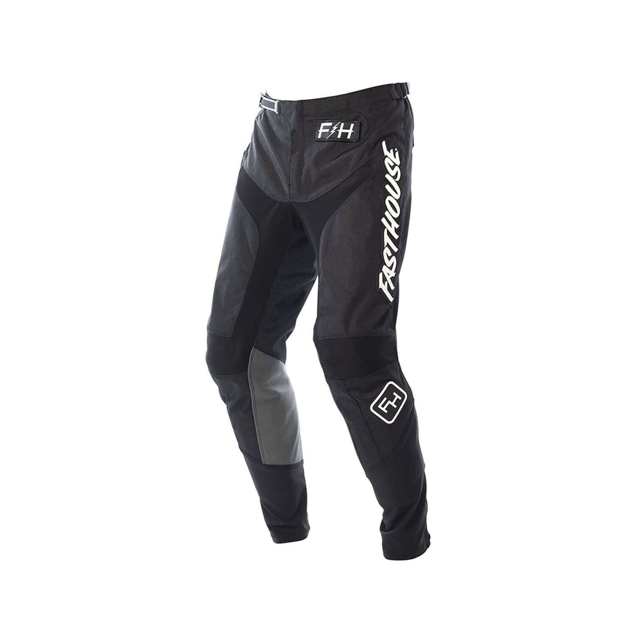 Youth motocross pants in black with gray panels and knee armor, Fasthouse logos.