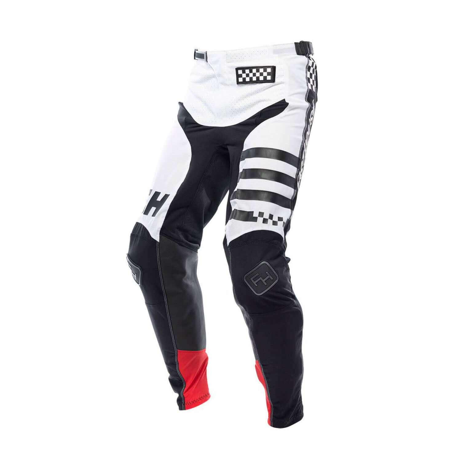 White youth motocross pants with black panels, checker waistband, red knee cuffs