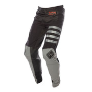 Black riding pants with red logo, gray knee panels, and striped accents