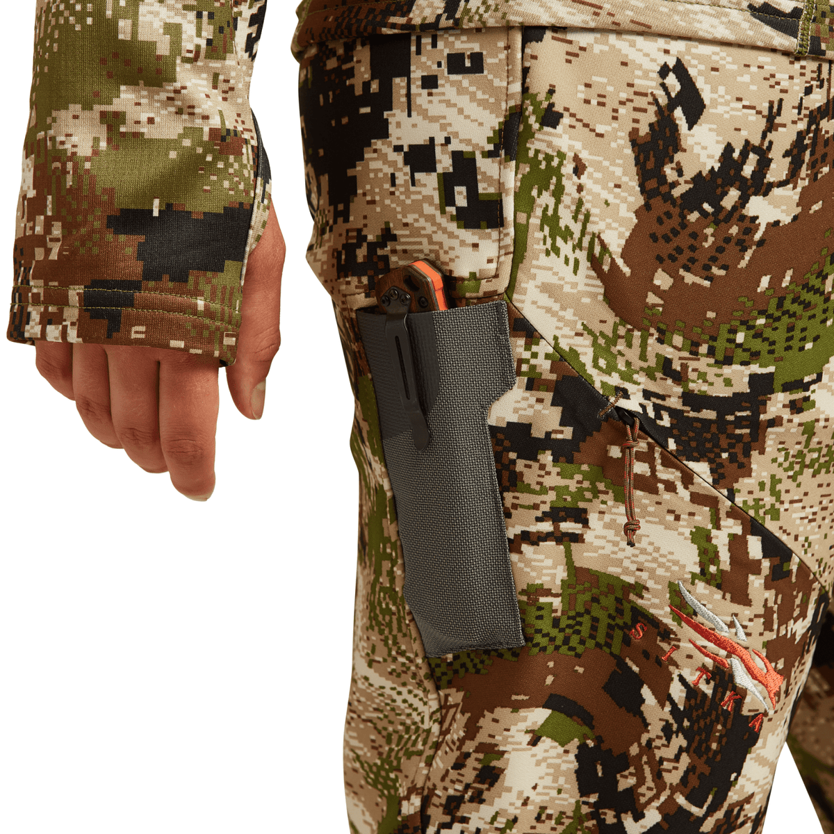 Hunting pants close-up with multicolor digital camo and gray zippered leg pocket