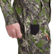 Men's camouflage hunting pants with thigh pocket panel, green-brown digital camo.
