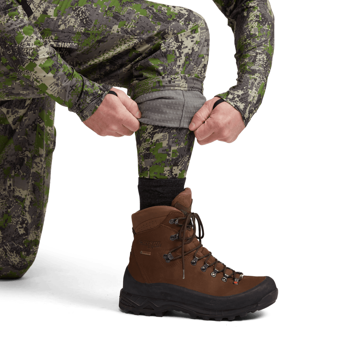 Men's camouflage hunting pants with cuffed hem, green-brown digital camo detail.