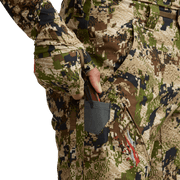Men’s camo hunting pants with large thigh pocket and hanging mesh accessory