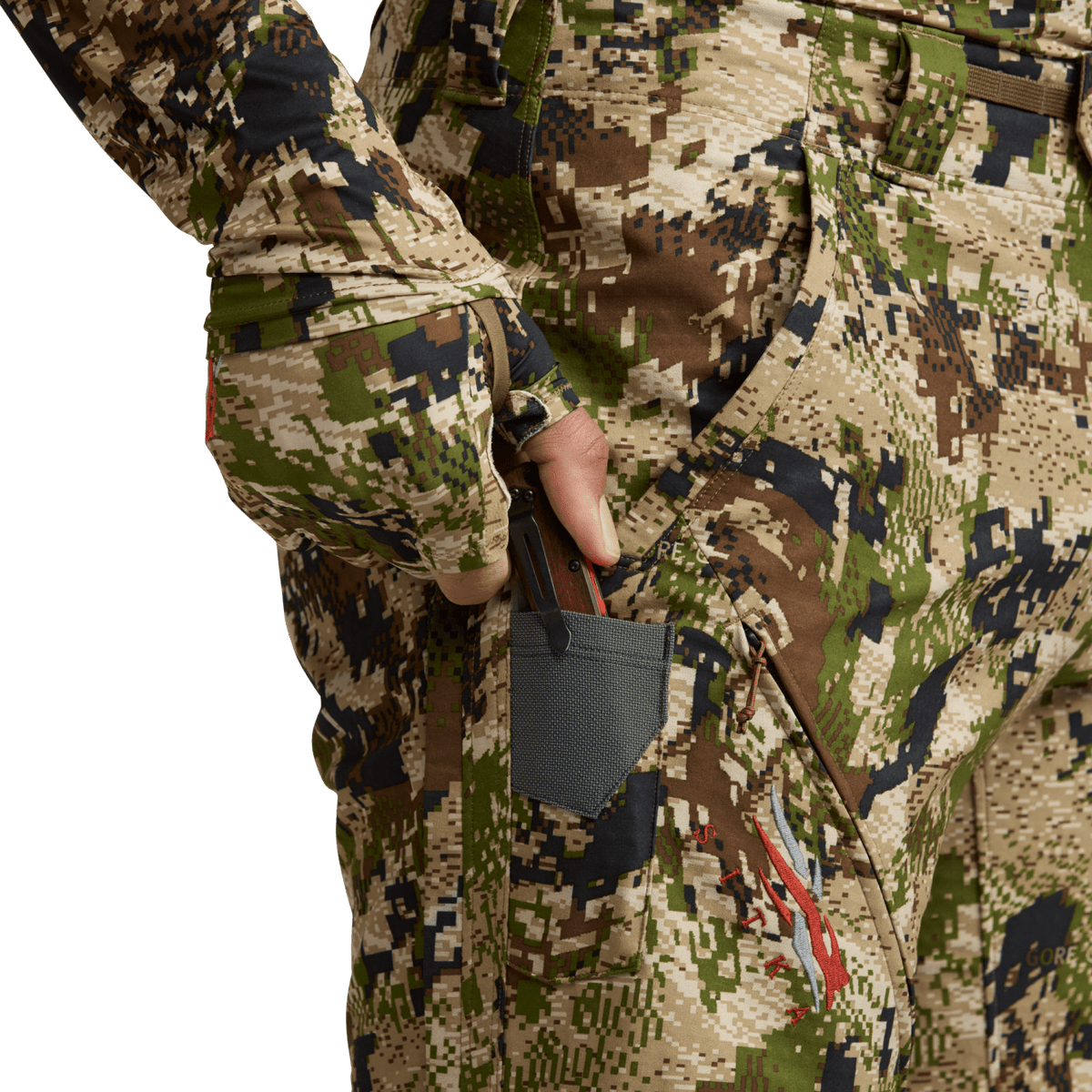 Men’s camo hunting pants with large thigh pocket and hanging mesh accessory
